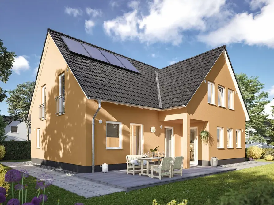 Das Domizil 192 in der Variante Trend mit Blick von Garten auf die Terasse und das Zweifamilienhaus